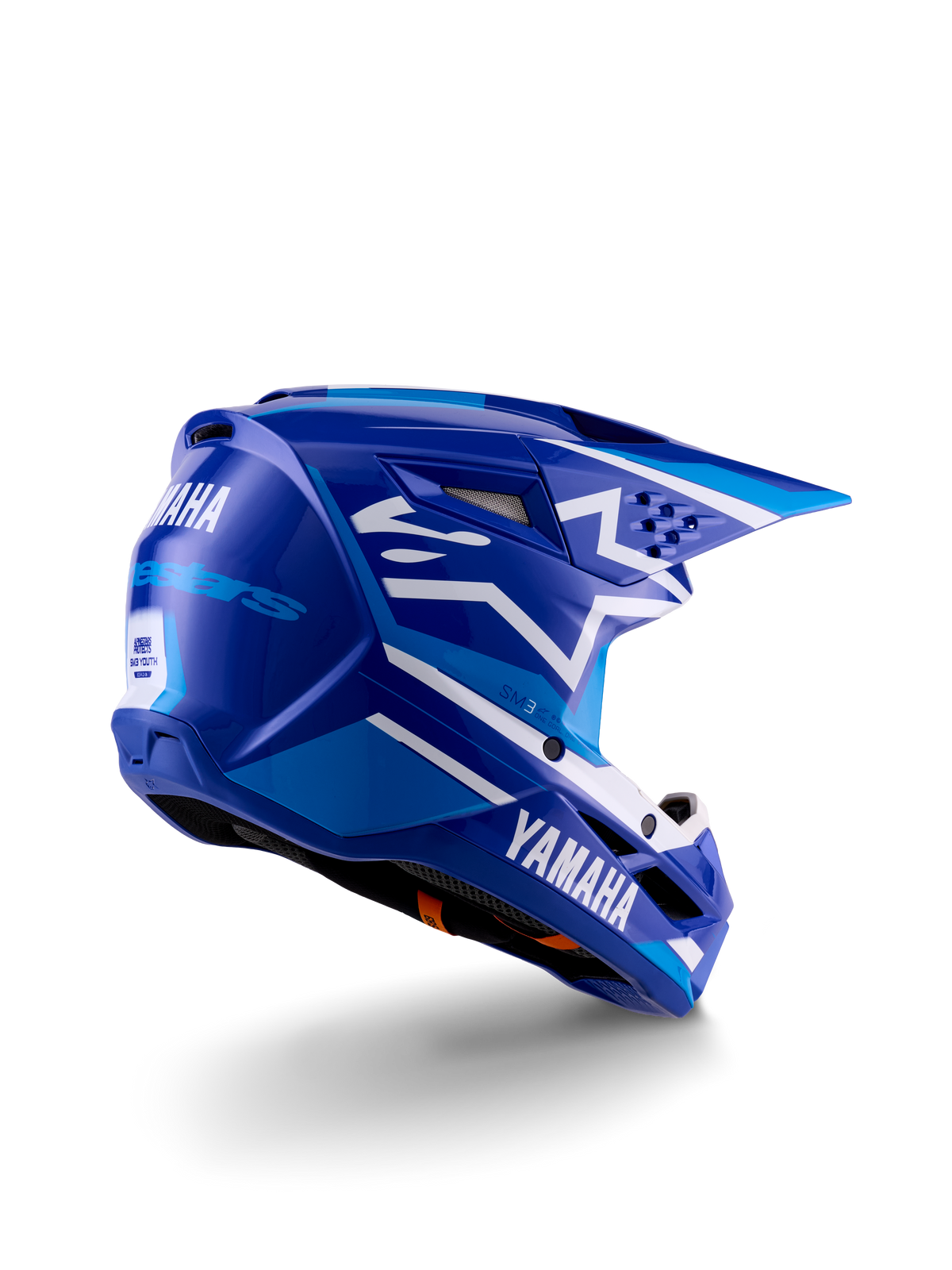 Alpinestars Yamaha S-M3 Jugend-Motocross-Helm, Blau und Weiß glänzend, mit markantem Yamaha-Branding an der Seite und Rückseite, aerodynamisches Schalendesign mit Belüftung hinten, jugendspezifischer Offroad-Kopfschutz in der Dreiviertel-Rückansicht
