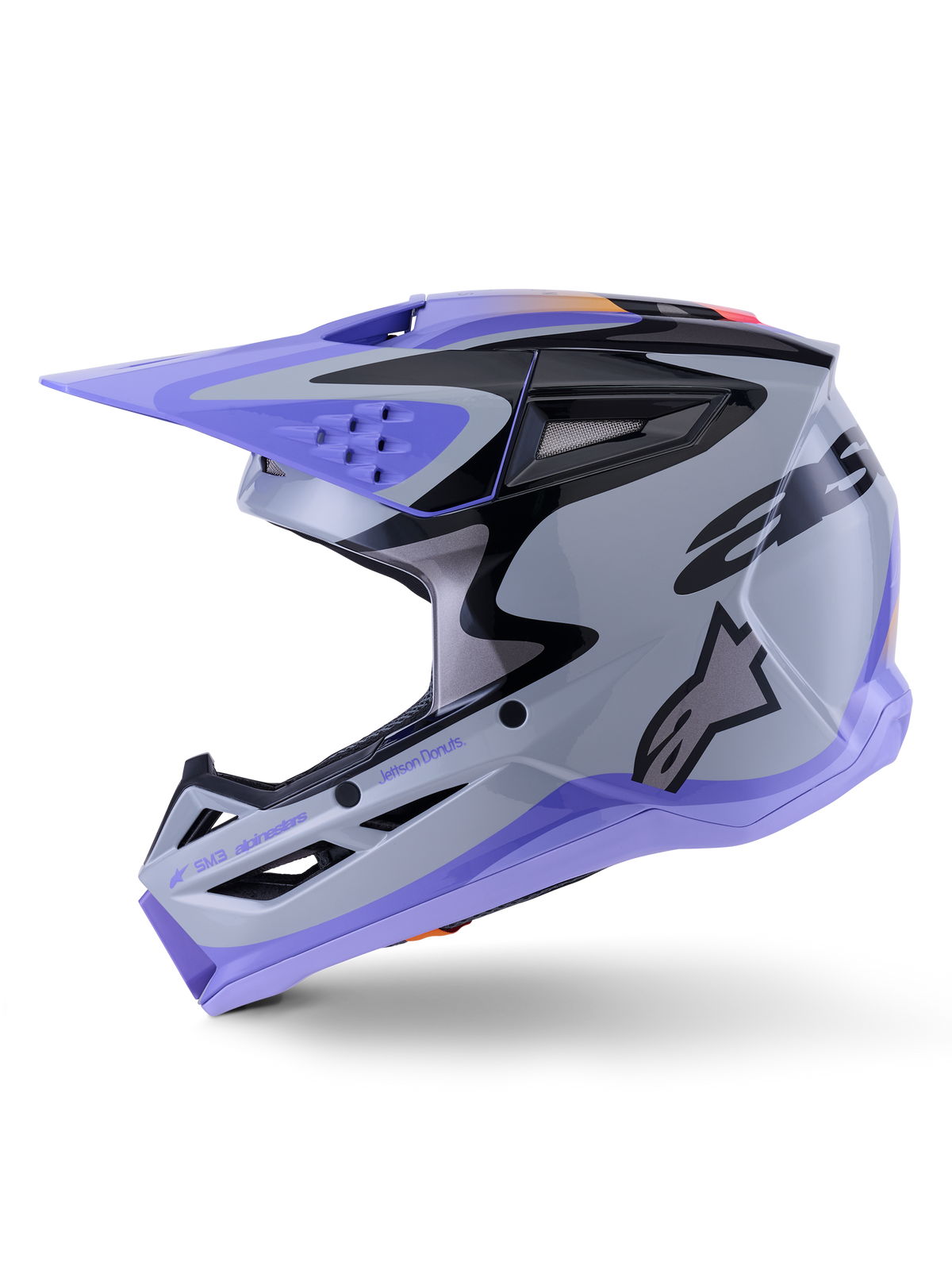 Alpinestars S-M3 Jettson Helm, Motocross-Helm, Grau, Lila und Schwarz glänzend, Seitenansicht mit eleganten Grafiken und verstellbarem Visier, mit mehreren Belüftungsöffnungen und Alpinestars-Markenlogo, leistungsstarker Offroad-Schutz