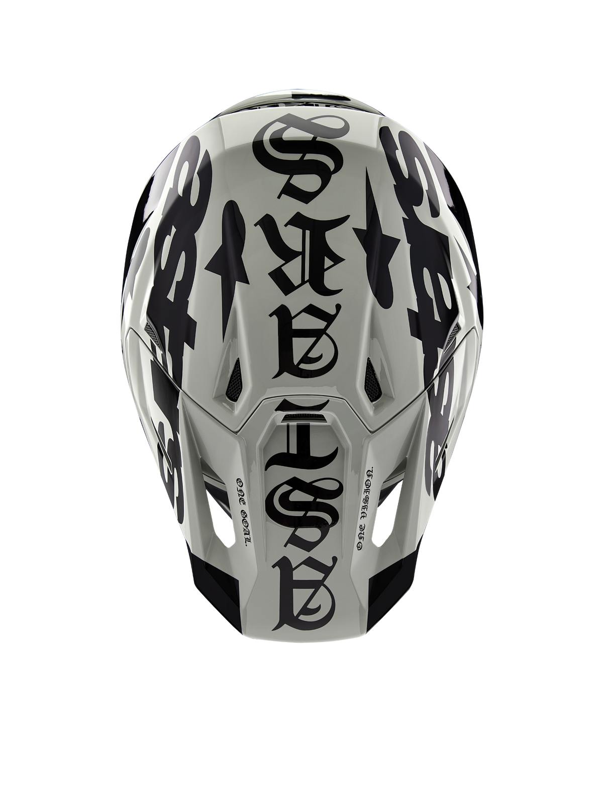 Alpinestars Limited Edition S-M7 Wolf Dust Helm, Draufsicht, glänzendes Finish in Dune und Schwarz, mit markanter Typografie im Gothic-Stil auf der Helmoberseite und „One Goal One Vision“-Details, professioneller Kopfschutz für den Motocross-Rennsport