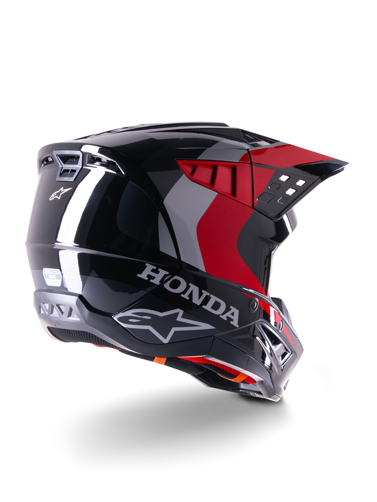 Alpinestars Honda S-M5 Helm ECE, Motocross-Helm, Schwarz Rot Glänzend, Rückansicht in Dreiviertel-Perspektive mit Honda-Branding und Alpinestars-Logos, glänzendes Finish mit roten und grauen Grafikakzenten, entwickelt für Offroad-Schutz