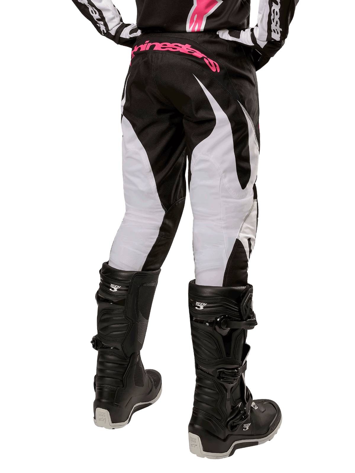 Alpinestars Damen-Stella 2024 Fluid Hose, Motocross-Hose, Schwarz und Weiß, Rückansicht mit weißen Beinbahnen und pinkem Branding am Hosenbund, kombiniert mit schwarzen Tech 3 Stiefeln, strapazierfähige Ausrüstung für den Offroad-Rennsport