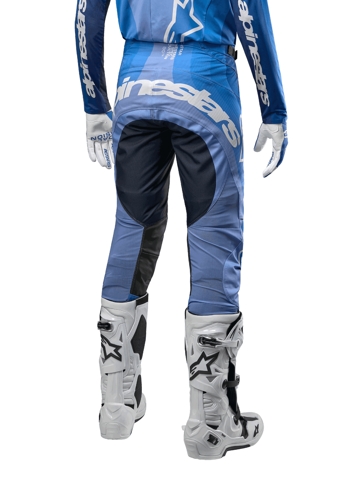 Alpinestars 2024 Techstar Pneuma Pants, Motocross Pants, Dark Navy and Light Blue, rear view featuring bold white branding on the seat and reinforced black panels, paired with white Tech 10 motocross boots.