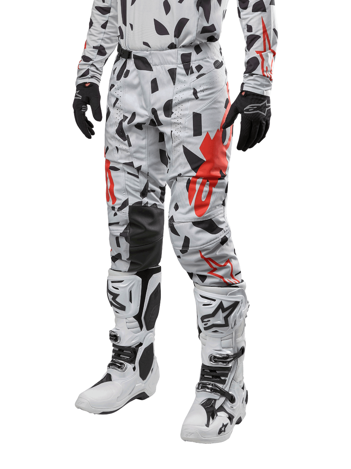 Alpinestars 2024 Techstar Rantera Pants, Motocross Pants, Haze Gray Camo with black and red abstract pattern, worn with matching jersey, black gloves, and white motocross boots, designed for high-performance off-road racing