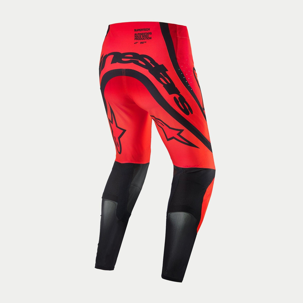 Alpinestars Supertech Ember LE Pants, Motocross Pants, Red Fluo and Bright Red with Black accents, rear view featuring bold black Alpinestars branding across the seat, star logos on the thighs, and technical mesh panels on the lower legs.