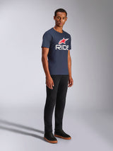 Alpinestars Ride 4.0 CSF Tee, Short Sleeve T-Shirt, Navy Blue, White RIDE logo with Red Alpinestars Star, worn by a model with black pants and sneakers, casual motorsport lifestyle apparel