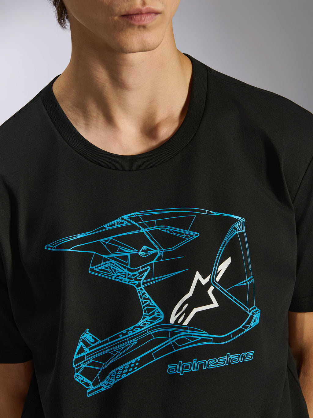 Alpinestars CSF Tee, Kurzarm-T-Shirt, Schwarz, blaue Motocross-Helm-Grafik mit weißem Stern-Logo, lässige Motorsport-Streetwear