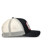 Alpinestars Heritage Patch Trucker-Mütze, Sportkappe in Schwarz und Weiß, Mesh-Rückseite, gebogener Schirm und Logo-Patch.