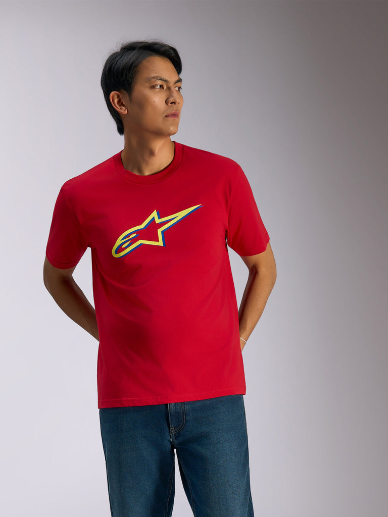 Alpinestars Ageless Shadow CSF Tee, Short Sleeve T-Shirt, Red, Yellow and Blue shadow logo on chest, casual motorsport streetwear worn with blue jeans