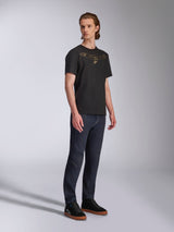 Alpinestars Luxo CSF Tee, Short Sleeve T-Shirt, Black, Gold Astars Outlined Chest Logo, worn by model with dark denim jeans and black sneakers, Casual Motorsport Streetwear