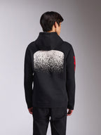 Alpinestars Obsessed Hoodie, Rückansicht eines schwarzen Fleece-Kapuzenpullovers, mit einer großen weiß gesprenkelten MX-Grafik mit Farbverlauf auf dem Rücken und roten Alpinestars-Wortlogos auf den Ärmeln, lässige, vom Motorsport inspirierte Streetwear