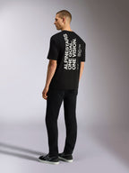 Alpinestars One Oversized CSF Tee, Kurzarm-T-Shirt, Schwarz, Rückansicht mit vertikaler weißer „ALPINESTARS ONE GOAL. ONE VISION.“ Grafik, Oversized-Passform, lässige vom Motorsport inspirierte Streetwear