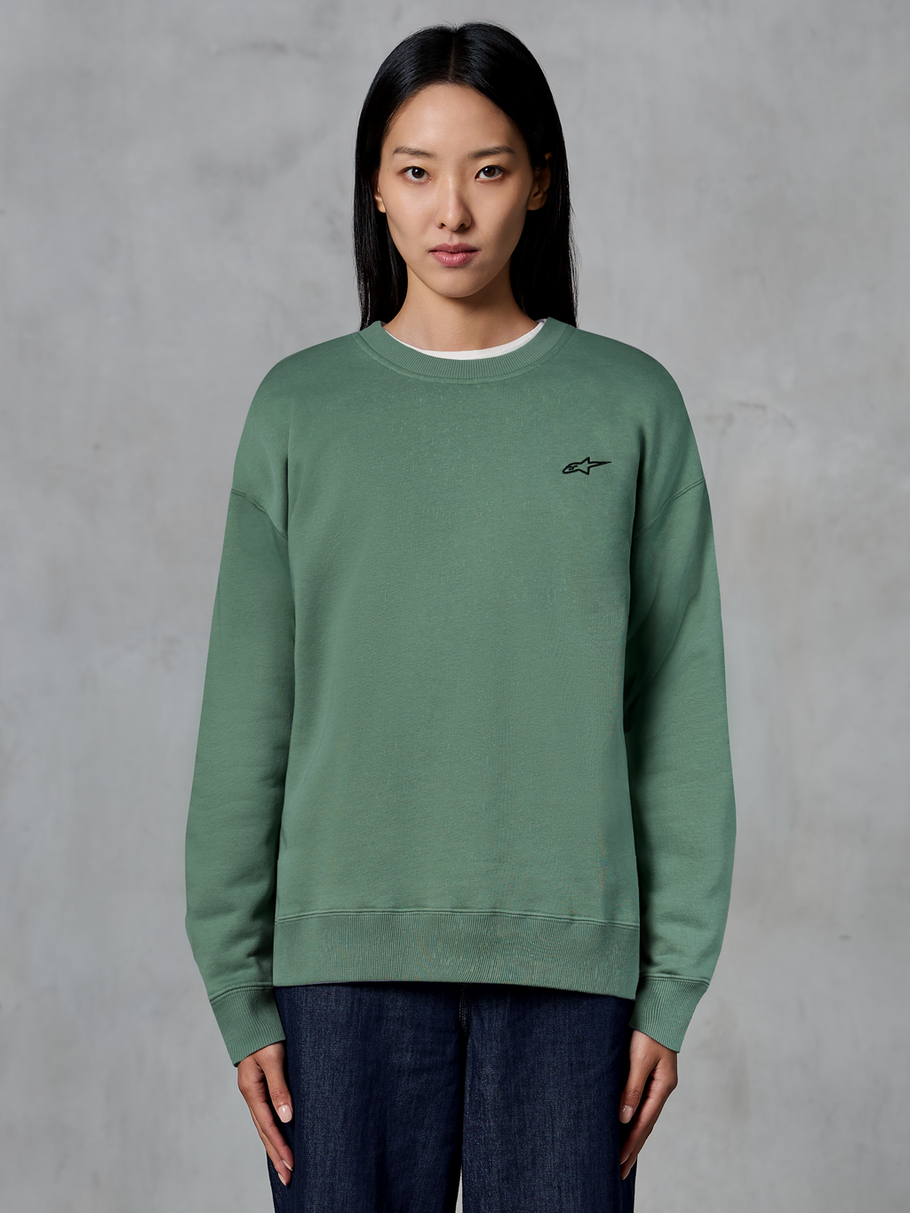 Alpinestars Essentials Ageless Crew, Crewneck Sweatshirt, Cactus Green, worn by a model, small black logo on the chest, ribbed collar, cuffs, and hem, casual motorsport streetwear