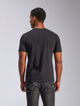 Alpinestars Tech Boot CSF Tee, Short Sleeve T-Shirt, Black, back view of a man wearing the tee with dark grey jeans, casual motorsport streetwear