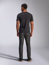 Alpinestars Tech Boot CSF Tee, Short Sleeve T-Shirt, Black, Back view on model, worn with dark gray jeans and black sneakers, casual motorsport-inspired streetwear