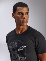 Alpinestars Tech Boot CSF Tee, Short Sleeve T-Shirt, Black, Grey Tech Boot Graphic with White Astars Logo, worn by a male model, Casual Motorsport Streetwear