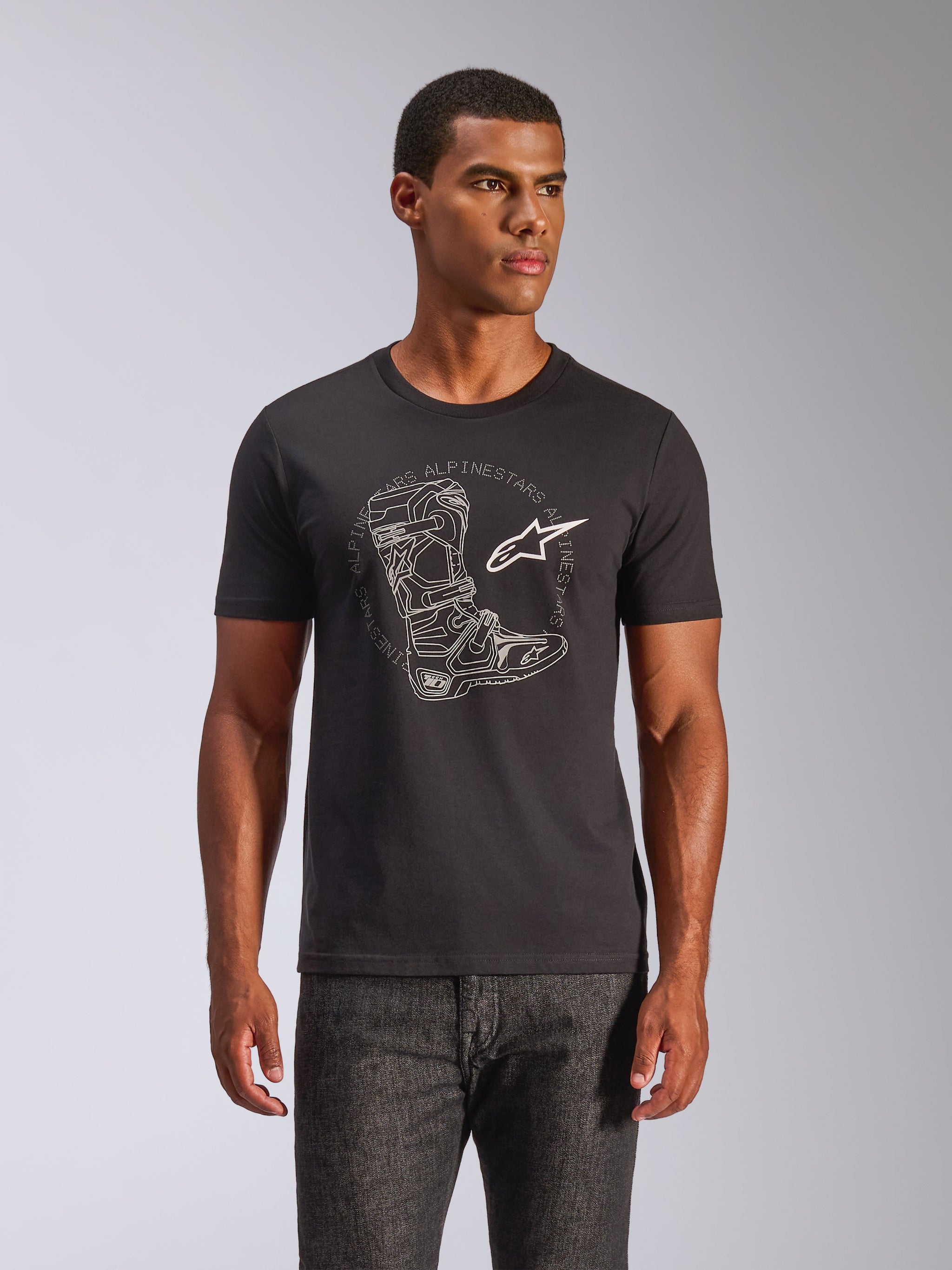 Alpinestars Tech Boot CSF Tee, Short Sleeve T-Shirt, Black, White Motocross Boot Graphic and Star Logo, Casual Motorsport Streetwear, worn by male model