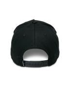 Alpinestars Specific Snapback Hat, Black, rear view featuring an adjustable plastic snap-back closure and a small white Astars logo on the back tag, structured crown, casual motorsport headwear