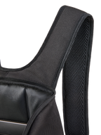 Alpinestars Defcon V3 Backpack, close-up of the padded air mesh shoulder strap and open main compartment, black 600D polyester, showing internal laptop sleeve and durable textile construction.