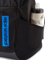 Alpinestars Defcon V3 Backpack, Black and Blue, close-up showing side mesh pocket with water bottle and vertical blue logo branding on durable black fabric