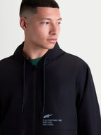 Alpinestars Speeder Resolve Windbreaker Jacket, Lightweight Hooded Sportswear for Urban Layering, Black, Polyester, Men's On-Model View featuring chest logo and speckled drawcords.