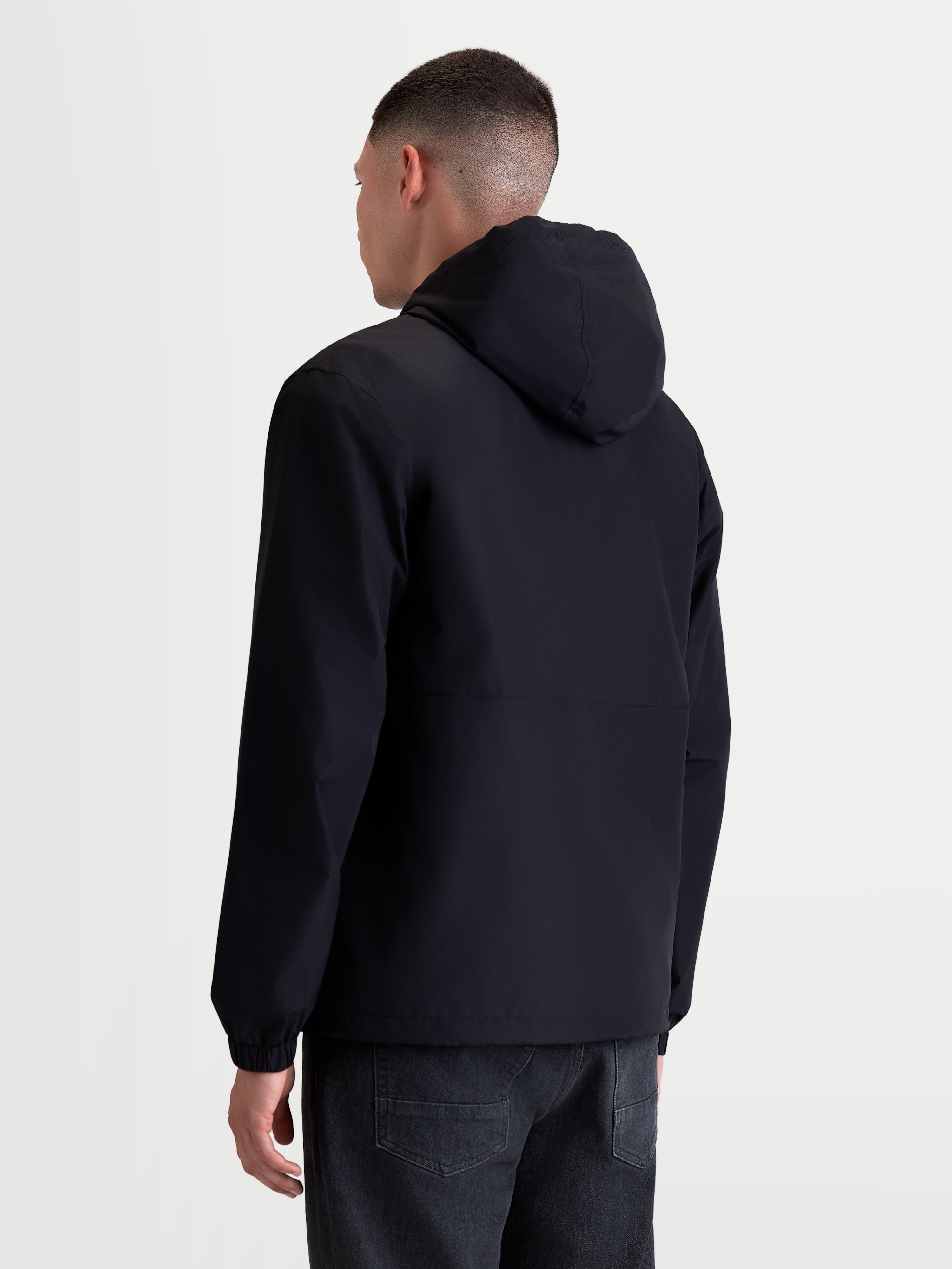 Alpinestars Speeder Resolve Windbreaker Jacket, Men's Sportswear Windbreaker for Urban Use, Black, back view on model, lightweight and breathable textile construction with an adjustable hood.