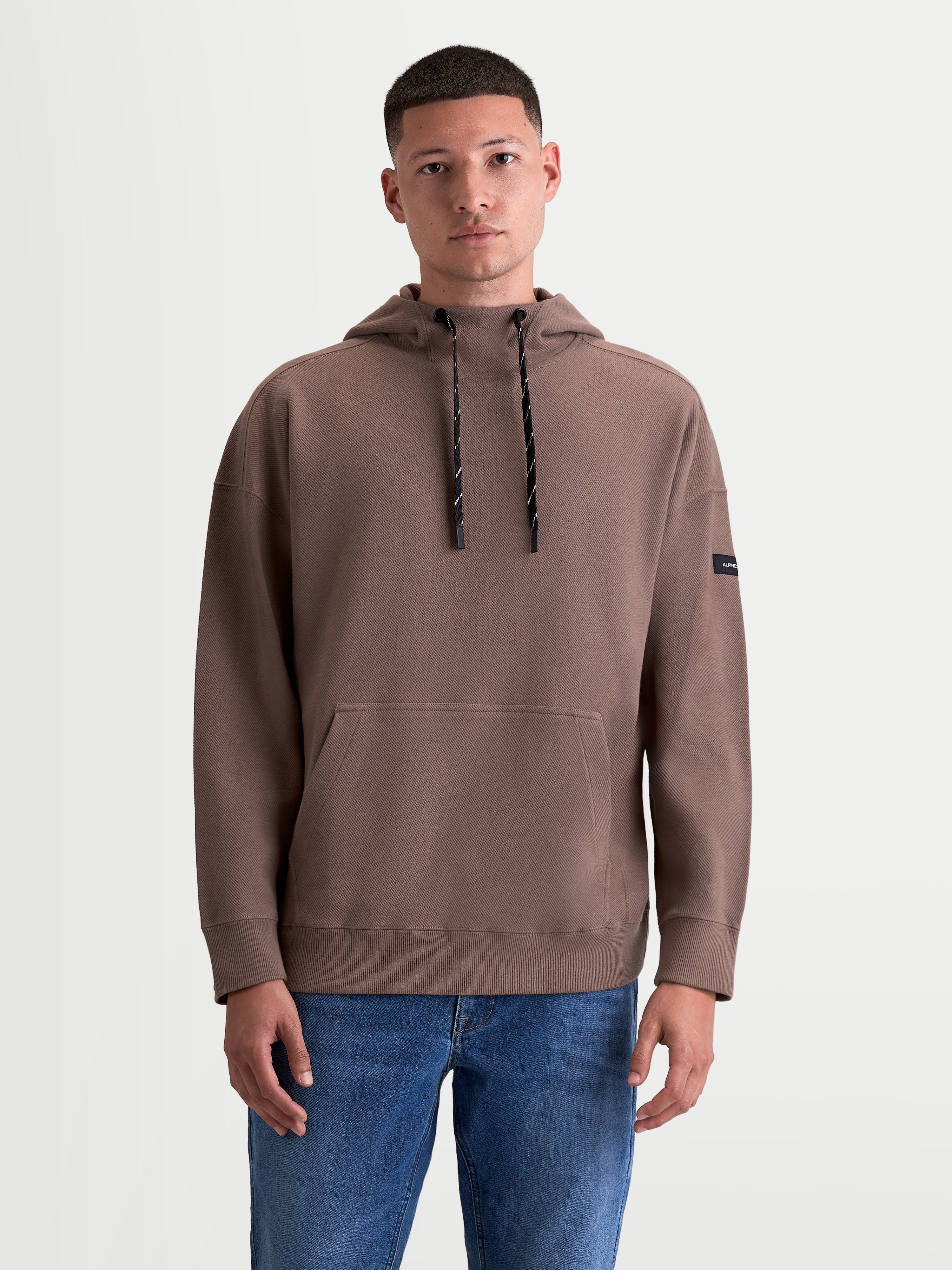 Alpinestars Camino Textured Oversized Hoodie, Herren-Kapuzenpullover für Sportswear, Taupe, strukturiertes Stricktwill-Fleece mit hohem Kragen, Kängurutasche und entspannter Oversized-Passform.