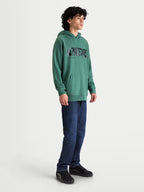 Alpinestars Shaw Oversized Hoodie, Men's Sportswear Pullover, Green, featuring a textured Alpinestars word logo, kangaroo pocket, and relaxed oversized fit in soft cotton and recycled polyester fleece, shown on-model.