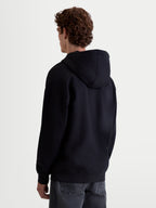 Alpinestars Prelude Oversized Hoodie, Sportswear Fleece-Pullover, Unisex, Schwarz, Rückansicht mit entspannter Silhouette, selbstgefütterter Kapuze und Rippbündchen an Ärmeln und Saum für ein sauberes Finish.