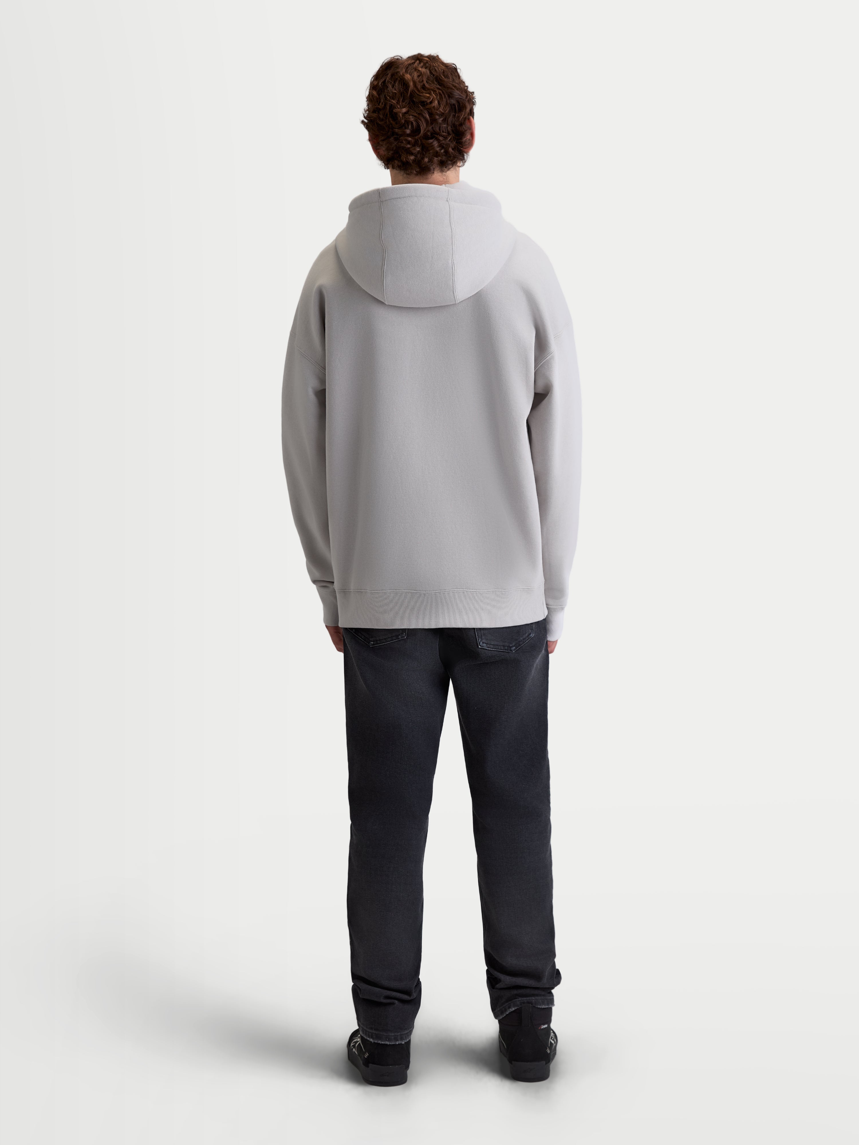 Alpinestars Entity Oversized Hoodie, Men's Sportswear Full-Zip Fleece, Cement Gray, back view showing the relaxed oversized fit, self-lined hood, and ribbed hem details, premium casual lifestyle apparel.