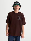 Alpinestars Post Oversized CSF Tee, Casual Sportswear Short Sleeve T-Shirt for Men and Women, Brown with White Astars Logo and One Goal One Vision Graphic, Relaxed Oversized Fit, Cotton-Poly Blend Construction.