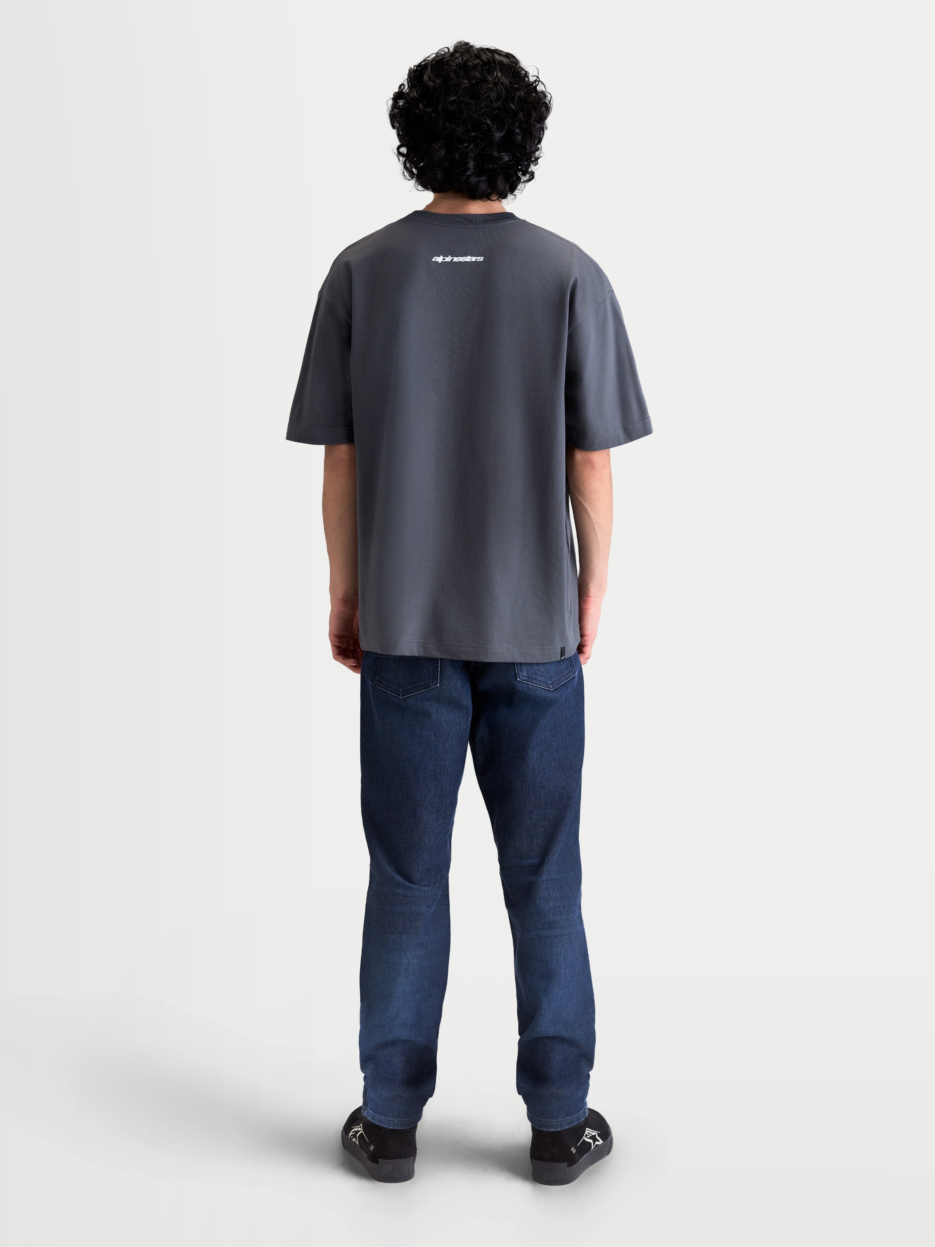 Alpinestars Mandate Oversized CSF Tee, Short Sleeve Sportswear T-Shirt, Unisex, Gray, cotton-poly blend, back view on model showing white Alpinestars wordmark graphic and relaxed oversized fit silhouette.