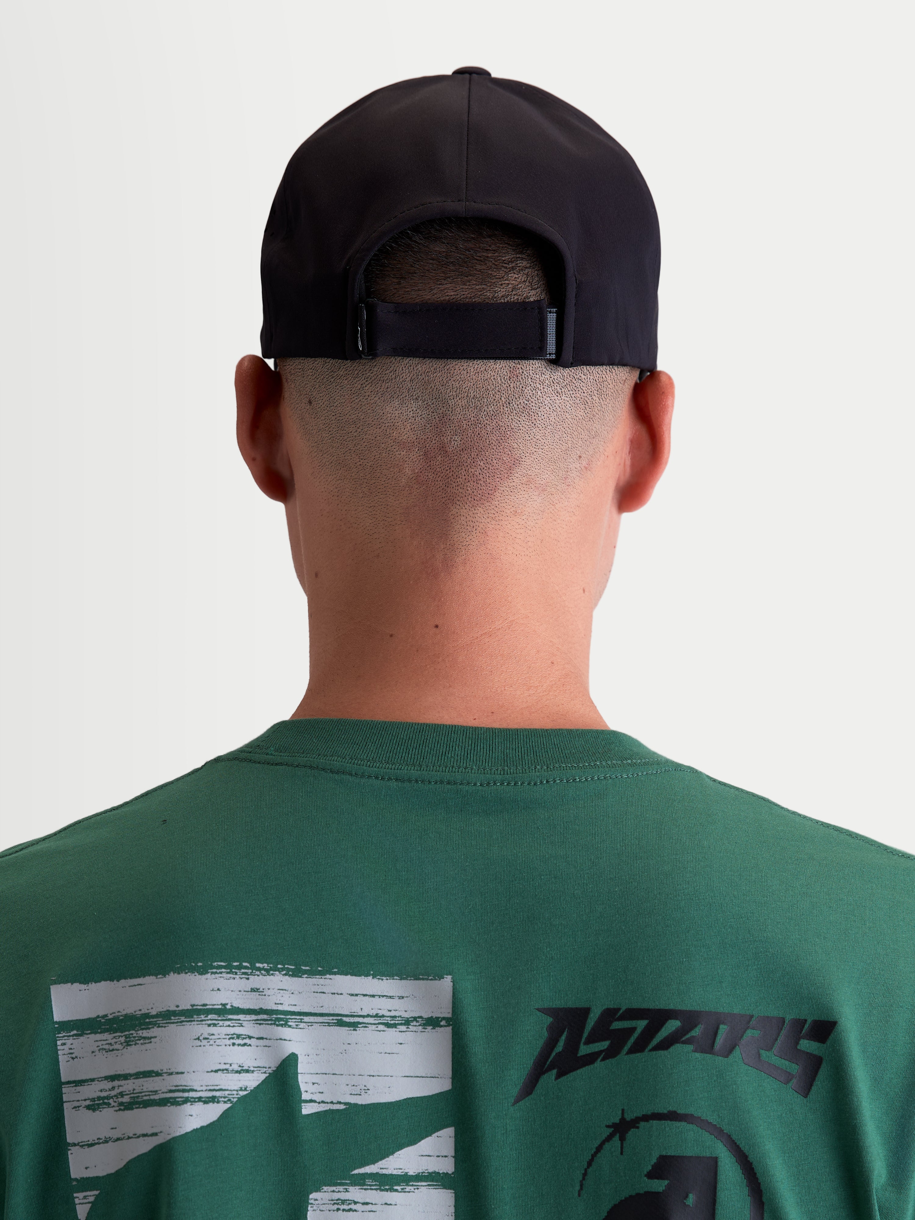 Alpinestars Algo Perf Adjustable Hat, Black Motorsport-Inspired Sportswear Cap, Rear View on Model showing Adjustable Closure, Technical Fabric Construction, Unisex.