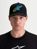 Alpinestars Meteorite Trucker Hat, Sportswear Curved Bill Cap for Men and Women, Black with a Blue and Yellow Astars Gravel Texture Logo Patch, Twill Front and Poly Mesh Back, On-Model Front View.