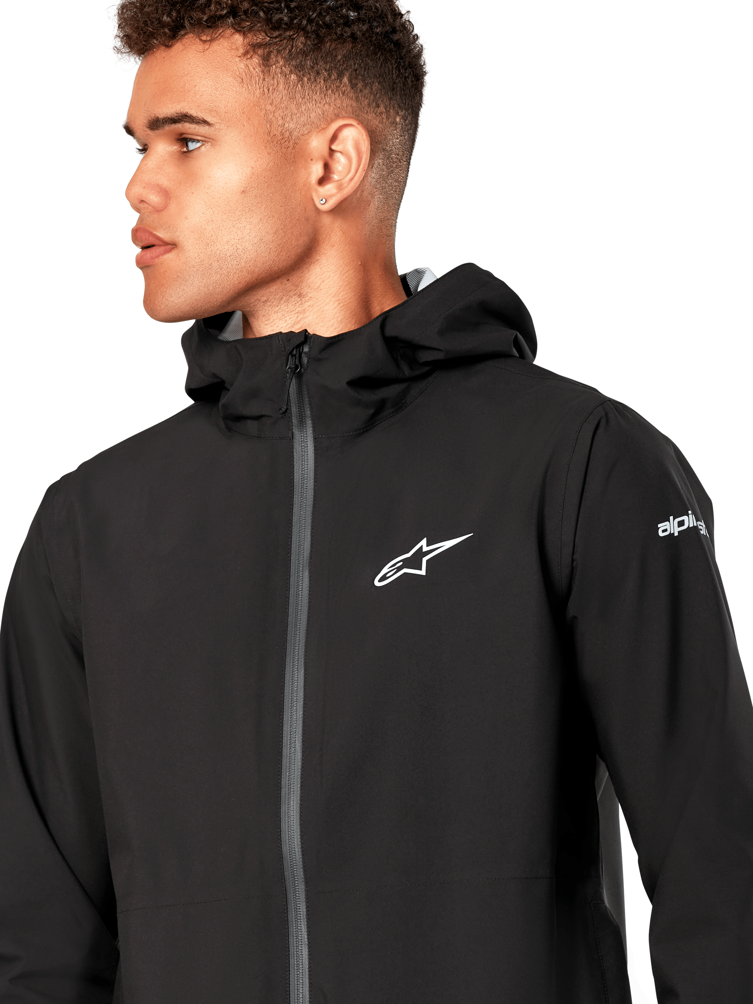 Alpinestars Kascade Regenjacke, schwarze Regenjacke, mit weißem Stern-Logo auf der Brust, fester Kapuze und beschichtetem umgekehrten Spiralreißverschluss vorne, lässige, vom Motorsport inspirierte Performance-Oberbekleidung