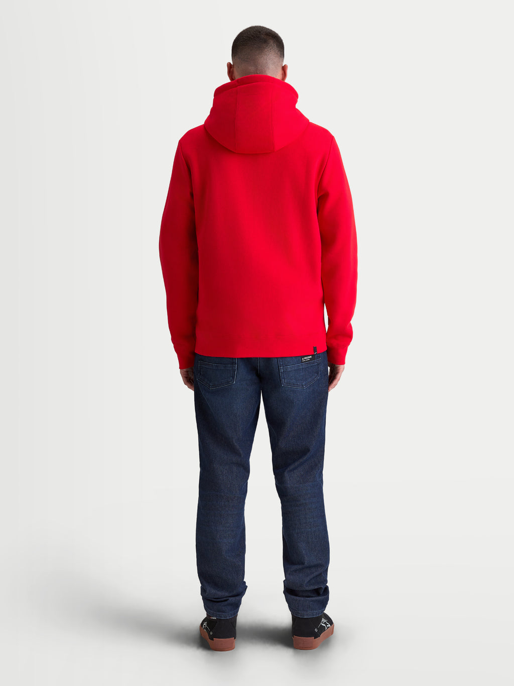 Alpinestars Ageless Zip V3 Hoodie, Red Sportswear Fleece for Men and Women, Back View on Model, featuring a comfortable hooded design with ribbed cuffs and hem, casual motorsport style.