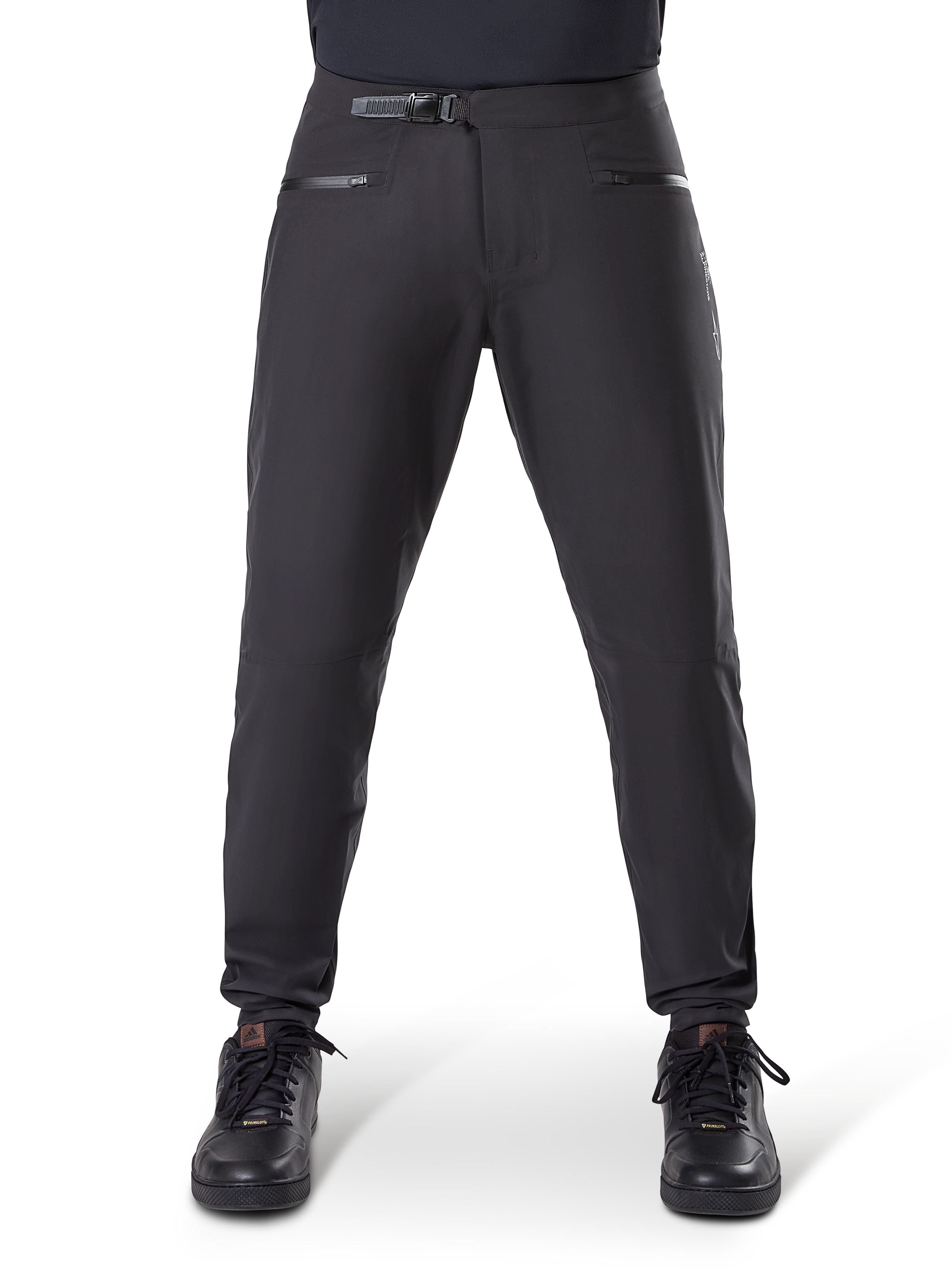 Alpinestars A-Dura Waterproof Pants, Black, mountain bike trousers featuring a ratchet waist closure and zippered pockets, front view on model paired with black shoes, durable waterproof gear for MTB