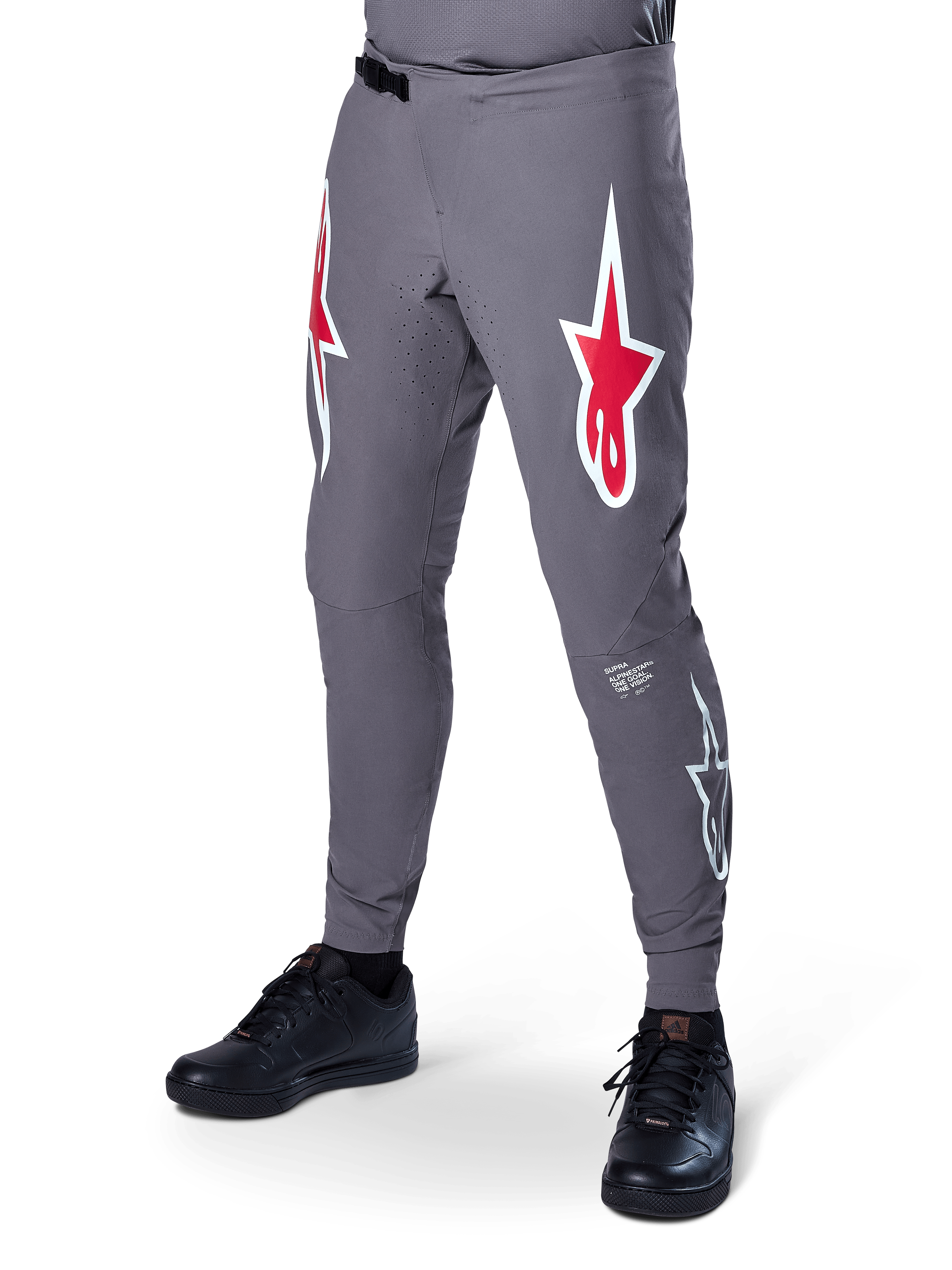 Alpinestars A-Supra Race Pants, Dark Gray Mountain Bike Pants, featuring large red and white star logos on thighs, laser-perforated ventilation, and a ratchet waist closure, performance fit for downhill and enduro racing