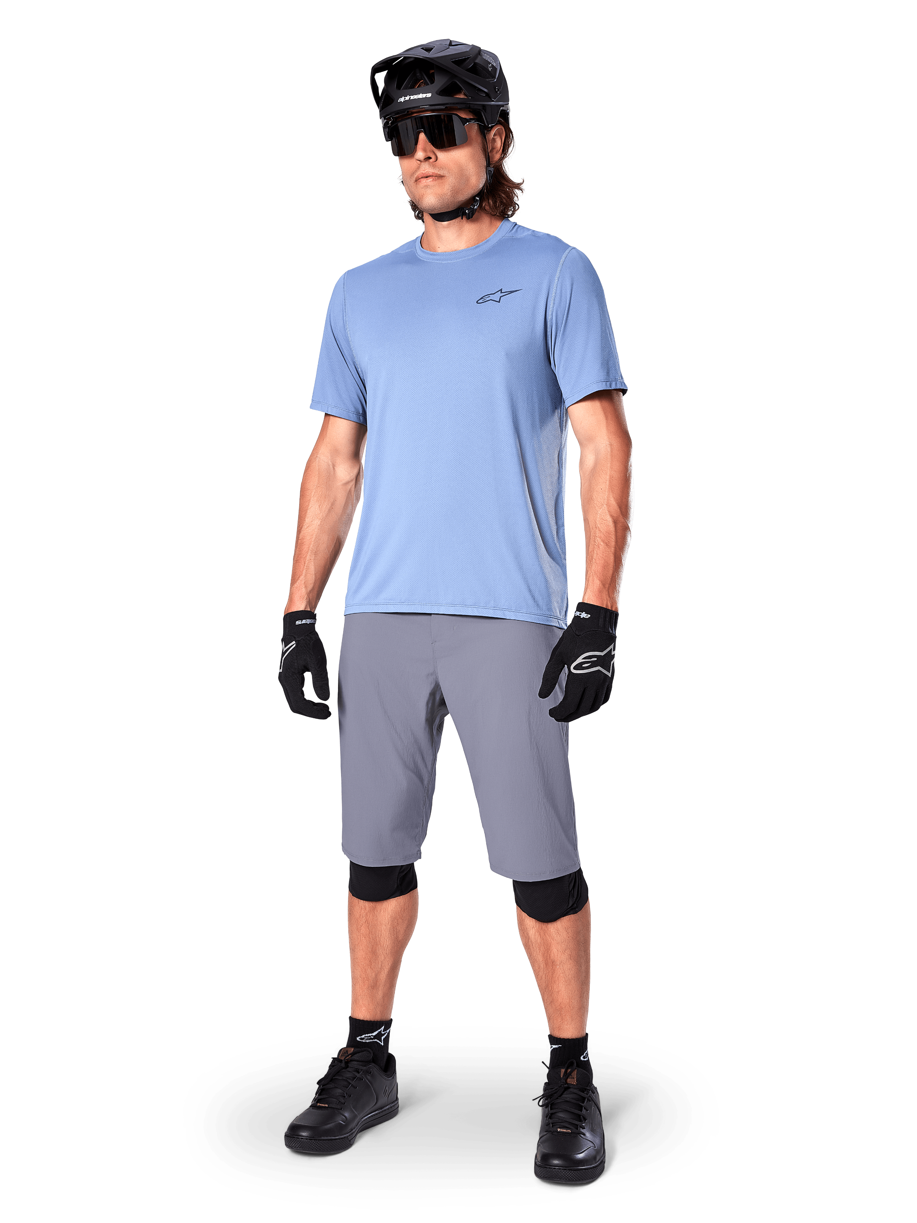 Alpinestars A-Dura Shorts, MTB Shorts, Dark Gray, worn by a rider with a light blue jersey, black MTB helmet, black gloves, and knee guards, complete mountain bike outfit for trail and off-road riding