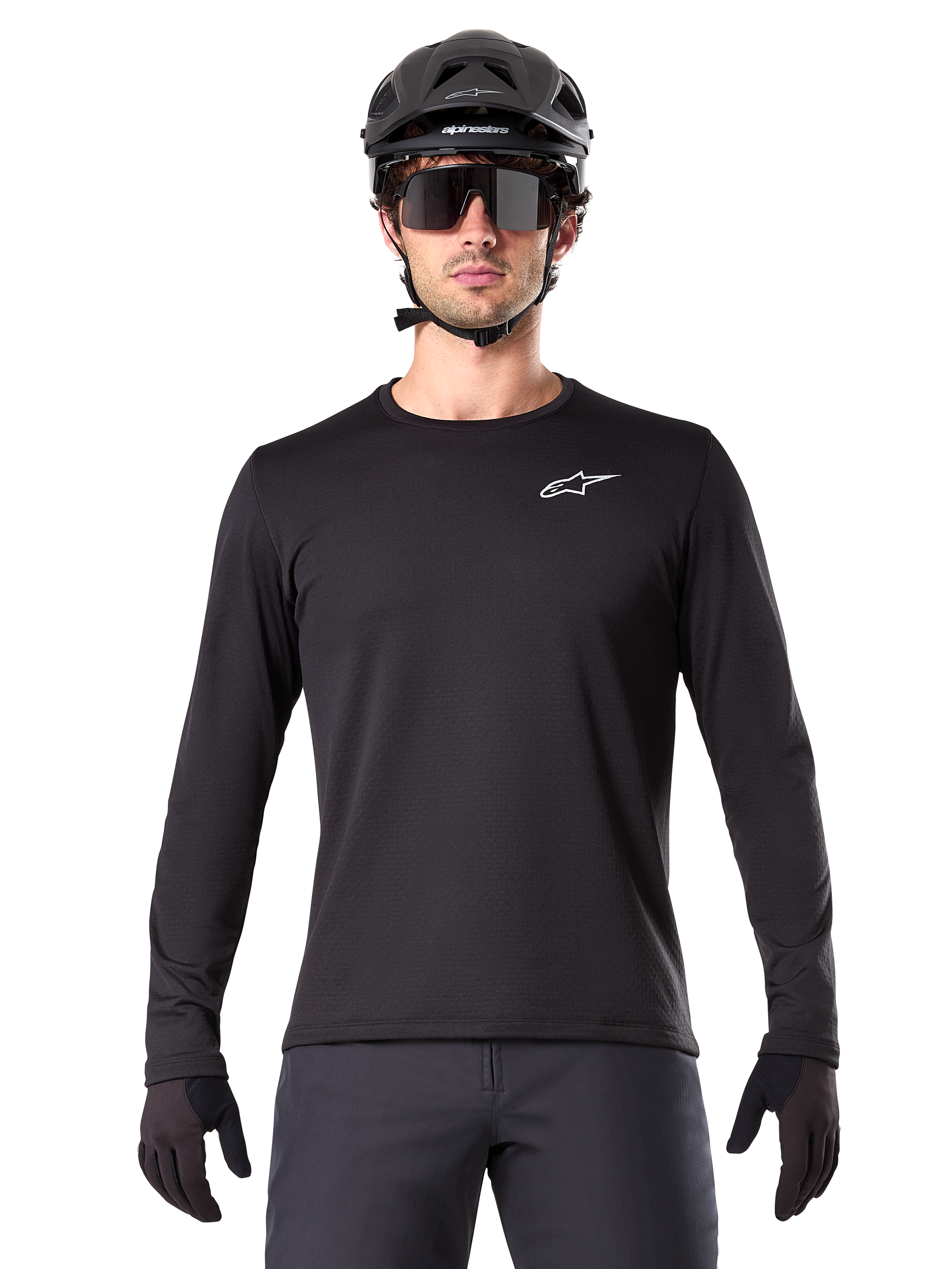 Alpinestars A-Dura Thermal Jersey, Black long-sleeve mountain bike jersey, worn with a black helmet and large sunglasses, featuring a small white Alpinestars logo on the chest, regular fit, MTB cycling apparel