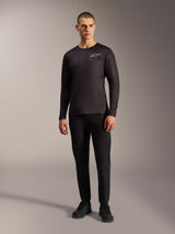 Black A-Dura Air Long Sleeve Jersey, moisture-wicking MTB apparel with white Alpinestars logo on a male model.