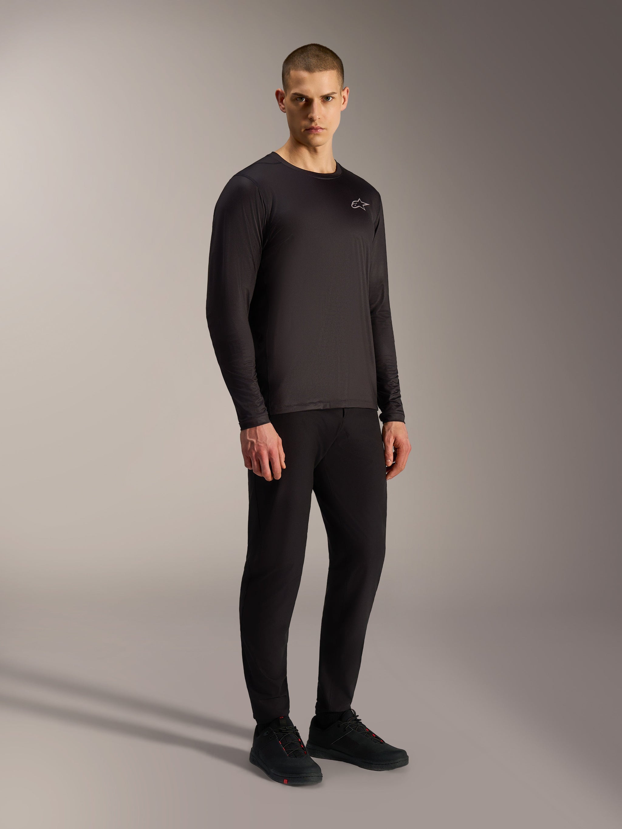 Black A-Dura Air Long Sleeve Jersey, breathable MTB top with moisture-wicking jacquard fabric and small chest logo.