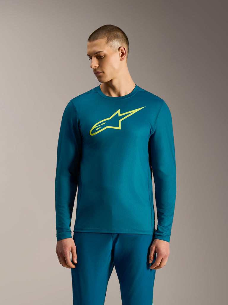 Blue Green A-Dura Ride Long Sleeve Jersey with a lime yellow Alpinestars logo, performance mountain bike apparel.