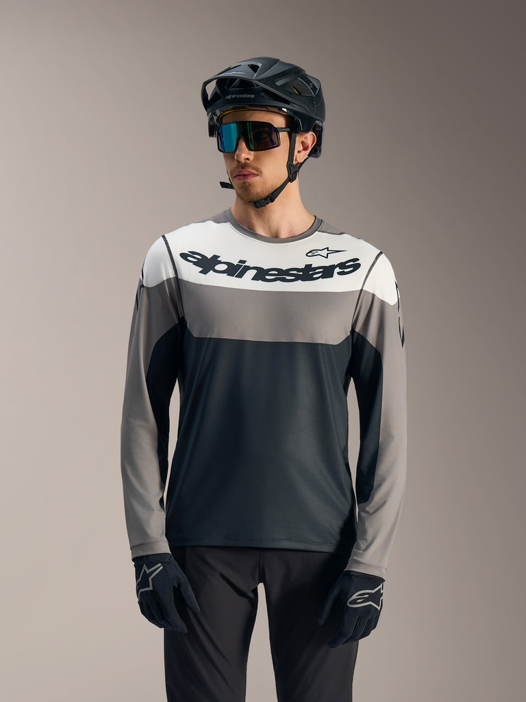 A-Dura Race Long Sleeve Jersey, grey and white color-block MTB top with Alpinestars logo, worn with cycling gear.