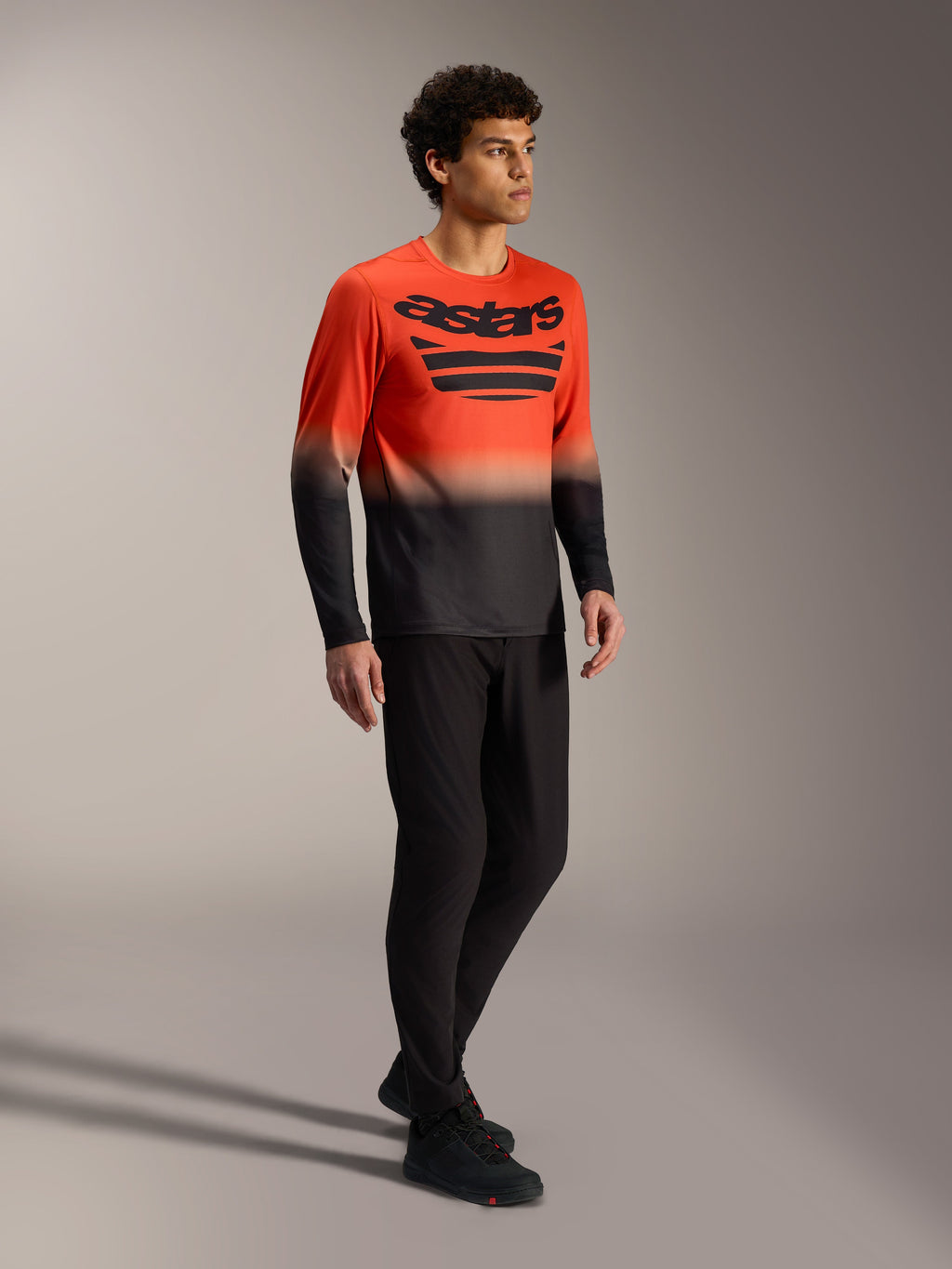 Orange and black A-Dura ASTARS Long Sleeve Jersey 2.0 with bold chest logo, designed for mountain bike performance.