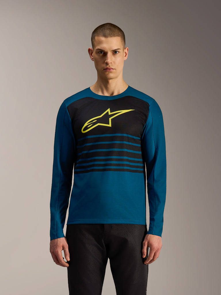 Blue-green A-Dura Elite Jersey 2.0 long sleeve MTB jersey with black chest stripes and yellow Alpinestars logo.
