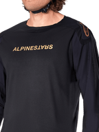 Alpinestars A-Aria Polartec Switch Long Sleeve Jersey, Black, featuring bronze Alpinestars branding on the chest and shoulder, laser perforations on the sleeves for ventilation, technical performance MTB apparel