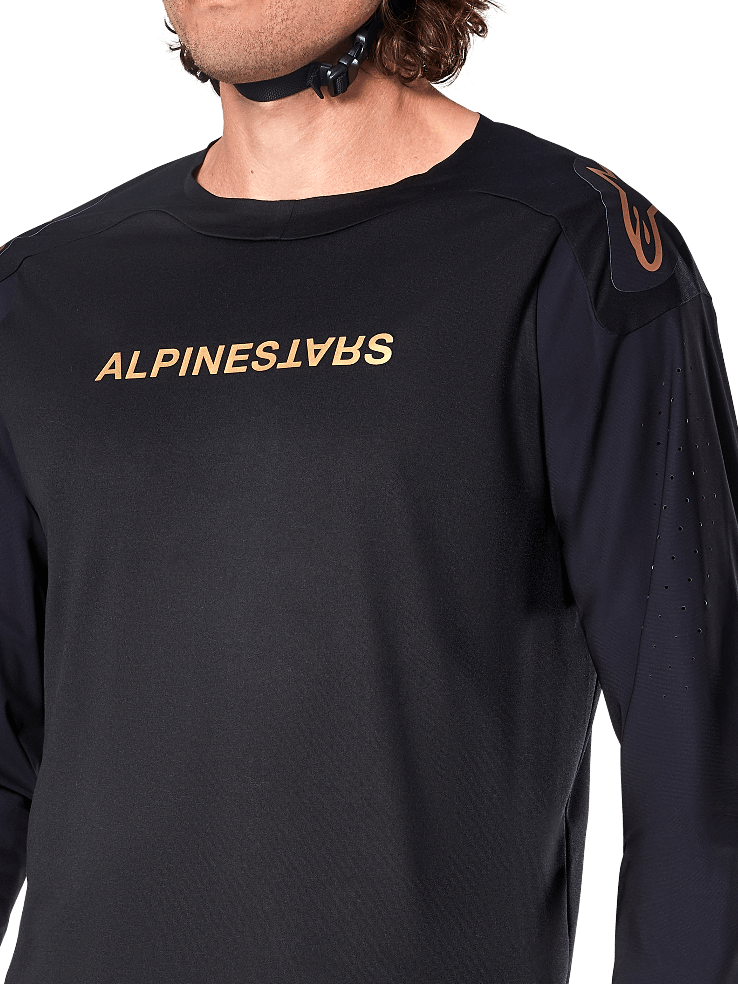 Alpinestars A-Aria Polartec Switch Long Sleeve Jersey, Black, featuring bronze Alpinestars branding on the chest and shoulder, laser perforations on the sleeves for ventilation, technical performance MTB apparel