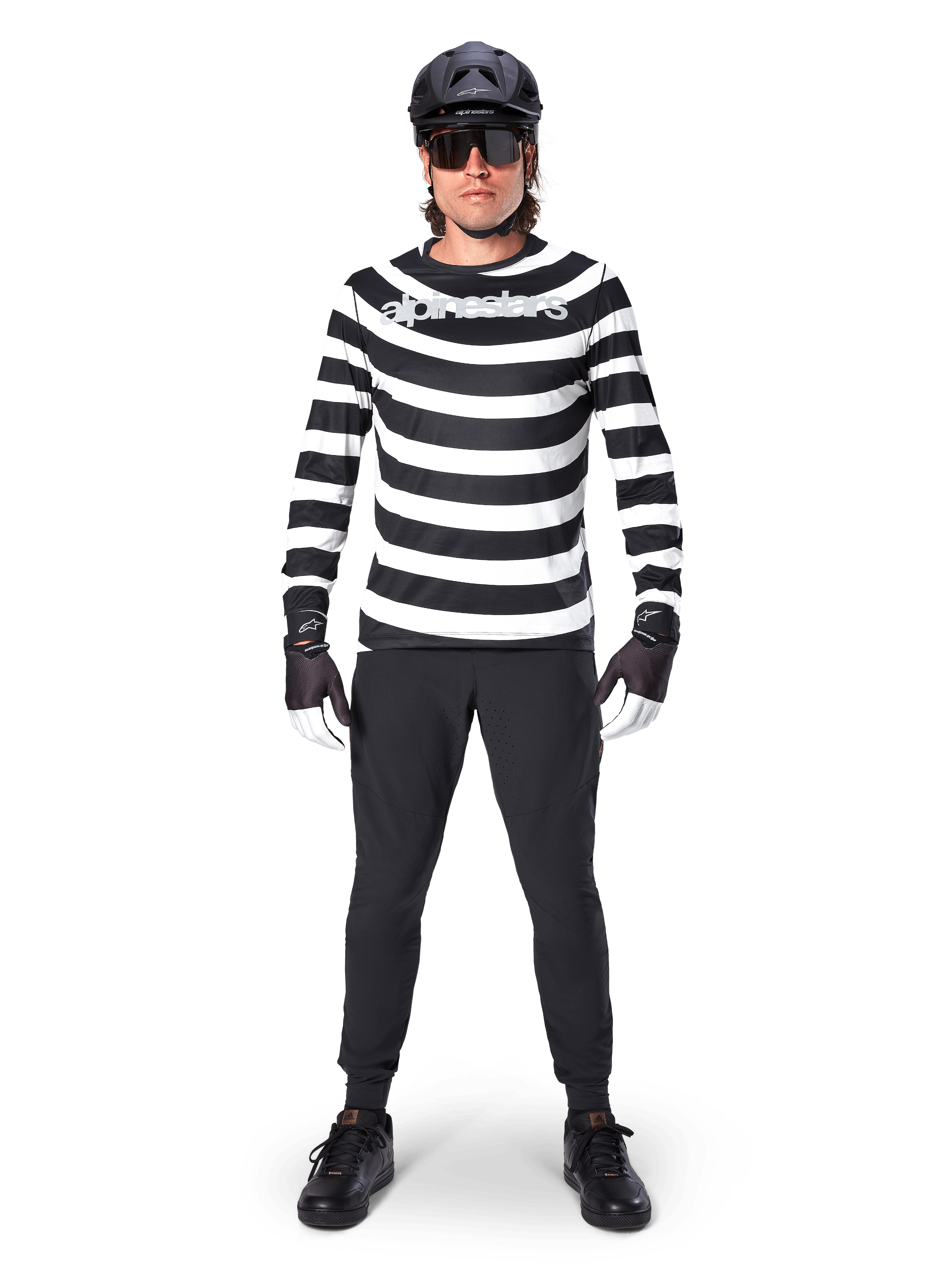 Alpinestars A-Aria Oscar Long Sleeve Jersey, MTB Jersey, Black and White horizontal stripes, worn with a black helmet and pants, featuring a vintage Oscar graphic and bold chest branding