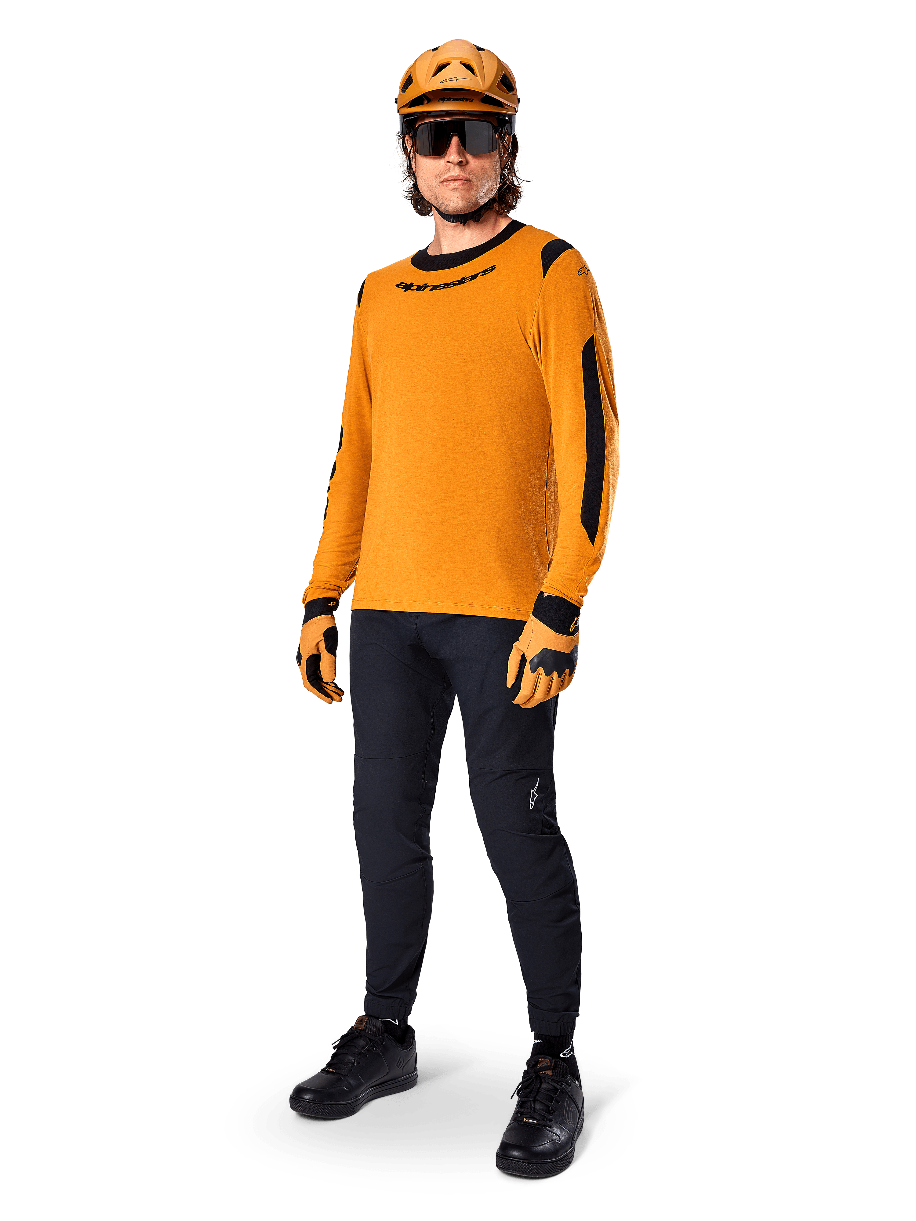 Alpinestars A-Dura Dri Wool Jersey - Long Sleeve, Dark Gold, worn with matching orange helmet, black MTB pants, and yellow and black gloves, full cycling outfit for off-road trail riding
