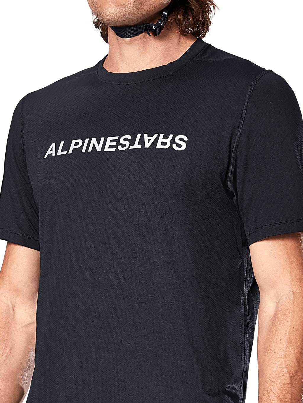 Alpinestars A-Dura Switch Short Sleeve Jersey, Black, featuring a large white wordmark logo screen-printed on the chest, performance jacquard fabric texture, close-up front view